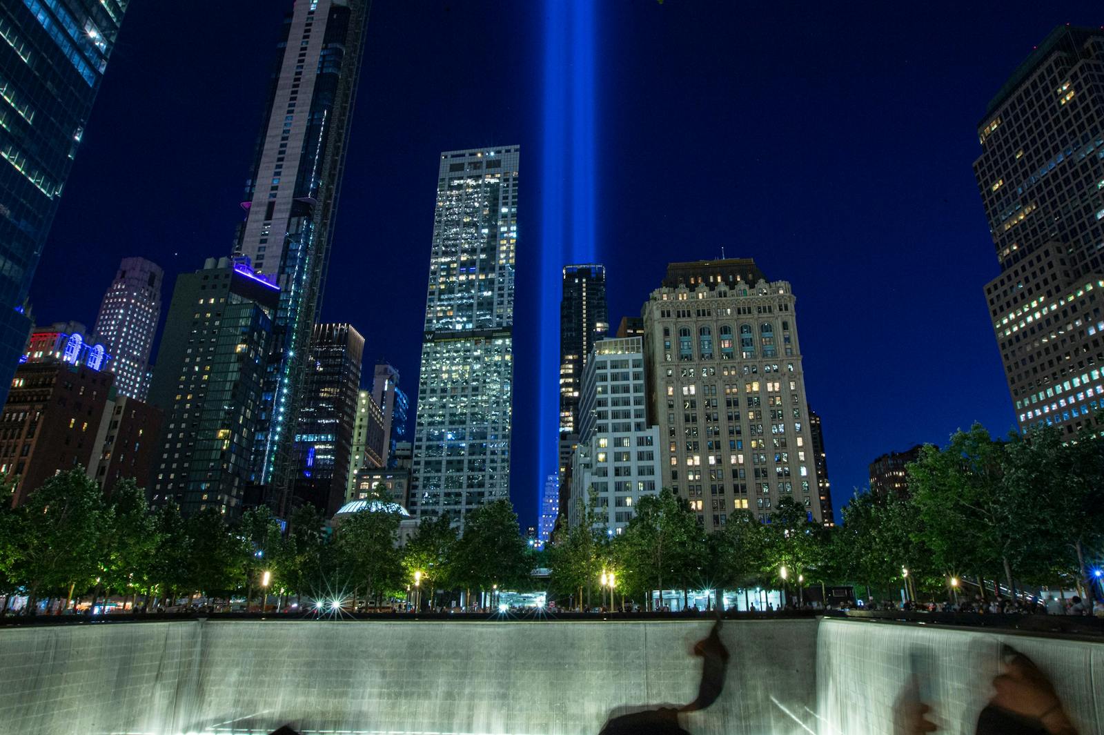 Night view of the 9/11 Memorial & Museum with light beams
