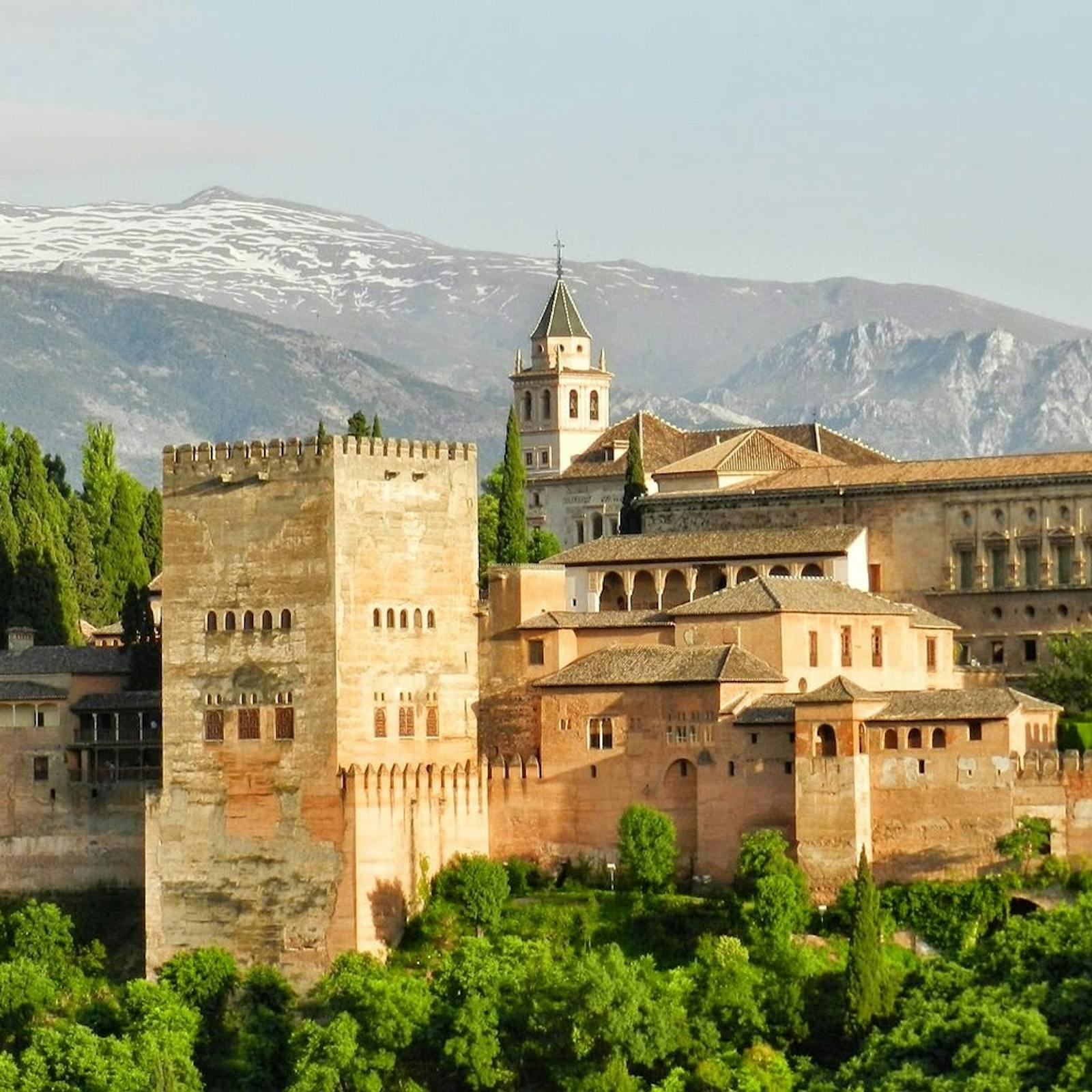 Panoramic view of the Alhambra with snow-capped mountains