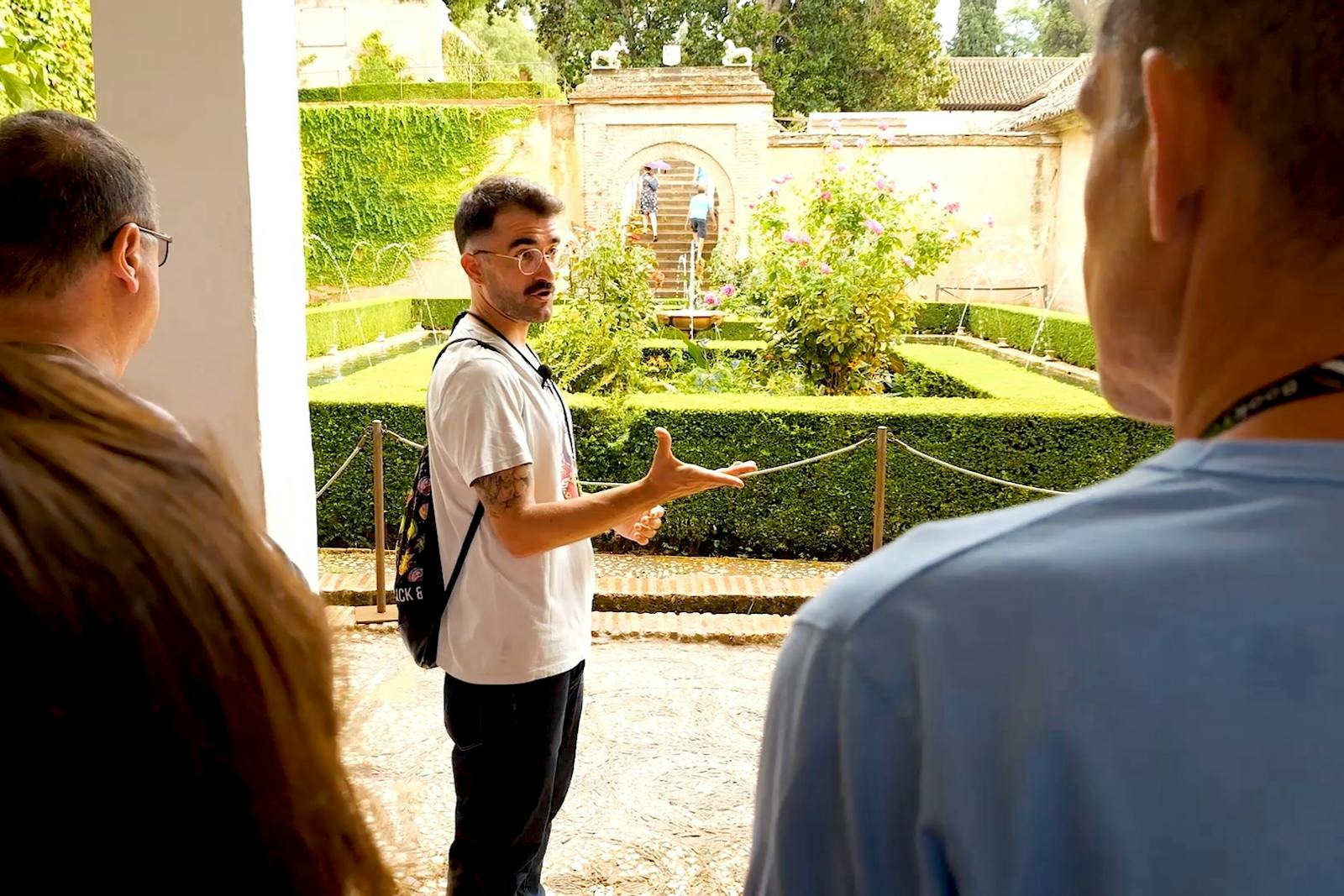 Tour guide explaining the Alhambra to the group
