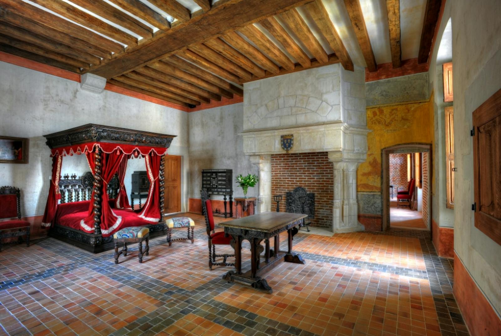 Historic interior of the Royal Château d’Amboise with canopy bed