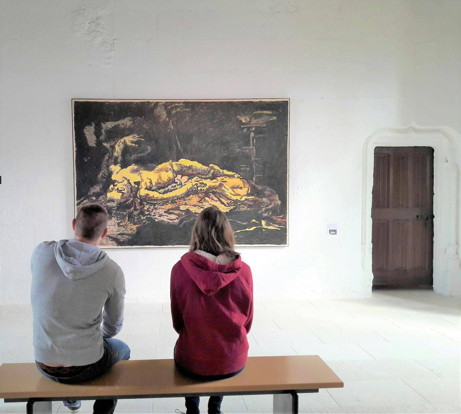 Visitors contemplating a work of art in Montsoreau Castle