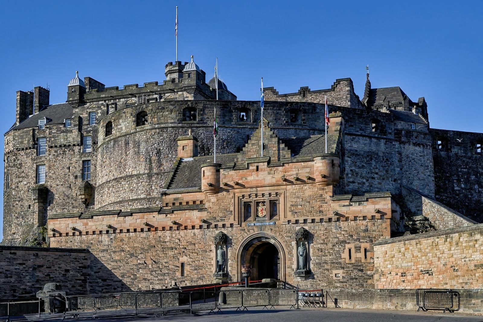 Low-angle view of the Edinburgh Castle under a blue sky